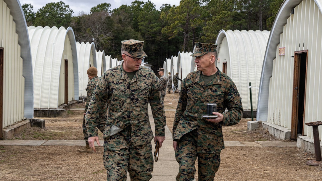 U.S. Marine Corps Col. Ryan Lynch, left, the commanding officer of the 24th Marine Expeditionary Unit, walks with Brig. Gen. Joel F. Schmidt, the assistant division commander of 2nd Marine Division, II Marine Expeditionary Force, during the MEUs certification exercise at Marine Corps Auxiliary Landing Field Bogue, North Carolina, Feb. 16, 2026. CERTEX is a land-based pre-deployment exercise that enhances the integration and collective capability of the Marine Air-Ground Task Force while providing the 24th MEU with an opportunity to train and execute operations in any clime, or place. (U.S. Marine Corps photo by Cpl. Daniel R. Garcia)