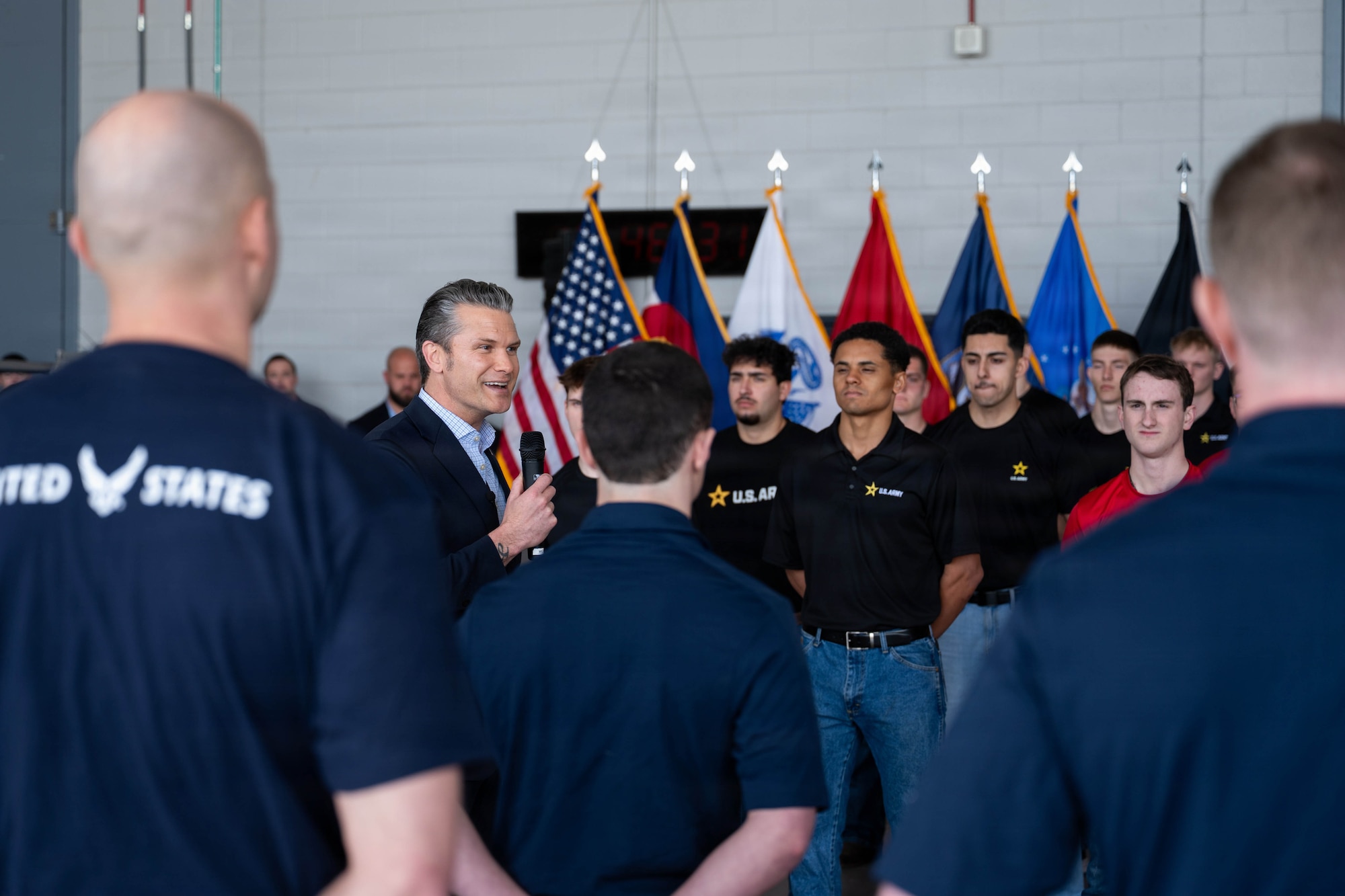 The Honorable Secretary of War, Pete Hegseth, administers the Oath of Enlistment to 40 Americans and honors top recruiters while visiting Colorado, Feb 23, 2026, Buckley Space Force Base, Colorado. Sister Services from the Air Force Reserve, National Guard, U.S. Army, U.S. Marine Corps, and U.S. Navy answered the Department of War’s call to support the mass enlistment. (DoW photo by U.S. Air Force Staff Sgt. Madelyn Keech)