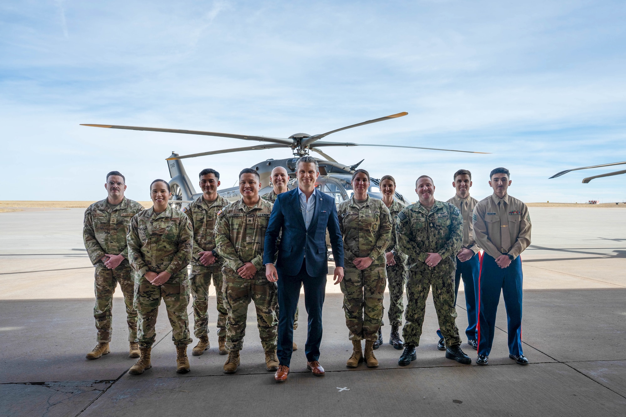 Honorable Secretary of War, Pete Hegseth, poses with Department of War recruiters from across the Air Force Reserve, National Guard, U.S. Army, U.S. Marine Corps, and U.S. Navy during a mass enlistment, Feb 23, 2026, Buckley Space Force Base, Colorado. The mass enlistment recognized 40 Americans who took the Oath of Enlistment and honored top recruiters. (DoW photo by U.S. Air Force Staff Sgt. Madelyn Keech)