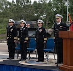 Navy Capt. Victor Diaz (left), deputy commander, Naval Medical Forces Pacific; Capt. Cheri Smiley, incoming commanding officer, Expeditionary Medical Facility 150 Alpha; Capt. Virginia Damin, commanding officer, Navy Medicine Readiness and Training Command Camp Pendleton and director, Naval Hospital Camp Pendleton; and Capt. Kenneth Basford, outgoing commanding officer of EMF 150 Alpha, stand at attention for Anchors Aweigh at the conclusion of the EMF 150 Alpha change of command ceremony aboard NHCP on Feb. 20, 2026. Basford relinquished command to Smiley, his executive officer, during the time-honored ceremony. Basford is retiring from the Navy after 30 years of active service. “I am very humbled to have served as your commanding officer, and I know Captain Smiley will take the command to even greater accomplishments,” said Basford during his remarks.