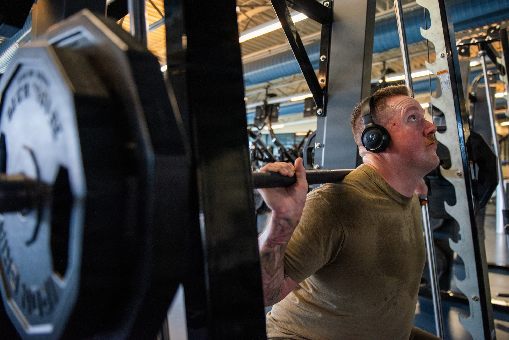 Airman performs weighted squats