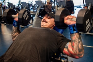 Airman performs chest press