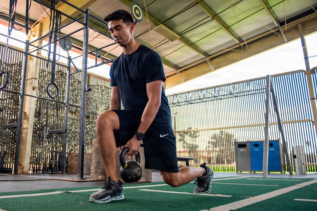 Airman performs lunges