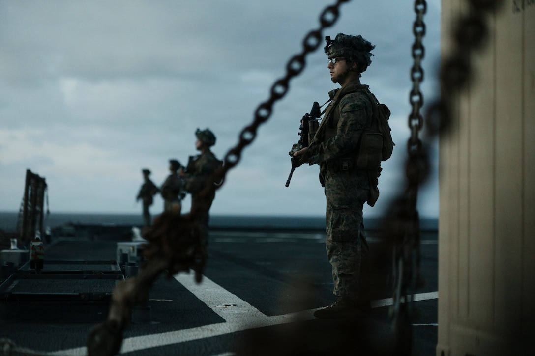 U.S. Marine Corps Lance Cpl. Christopher Perez-Reyes, an amphibious combat vehicle crewman assigned to Task Force Ashland, I Marine Expeditionary Force, provides security while scouting for surface contacts as part of the small craft action team during defense of the amphibious task force aboard amphibious dock landing ship USS Ashland (LSD 48) while transiting through the Surigao Strait Feb. 17, 2026. TF Ashland is a flexible, forward-deployed crisis response force led by the 15th Marine Expeditionary Unit. Purpose-built to integrate with allies and partners, TF Ashland supports a free and open Indo-Pacific by providing immediate response capabilities for any contingency. (U.S. Marine Corps photo by Gunnery Sgt. Manuel Serrano)