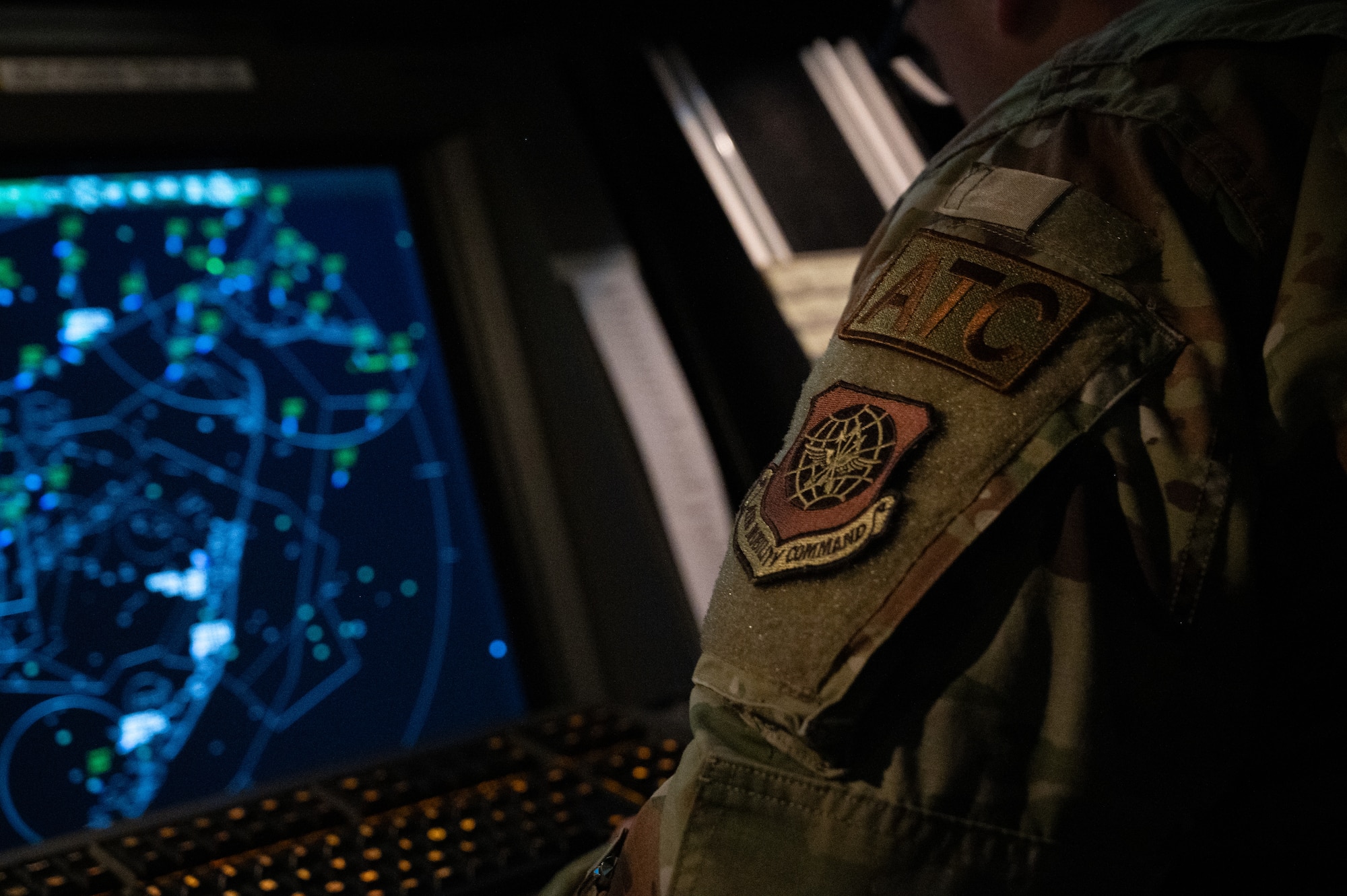 U.S. Air Force Senior Airman Anthony George, 305th Operations Support Squadron air traffic controller, checks flight plans on Joint Base McGuire-Dix-Lakehurst, N.J., Feb. 24, 2026. As Winter Storm Hernando moved throughout the region, personnel across the installation maintained mission readiness and essential base operations. (U.S. Air Force photo by Airman 1st Class Matthew Almazan)