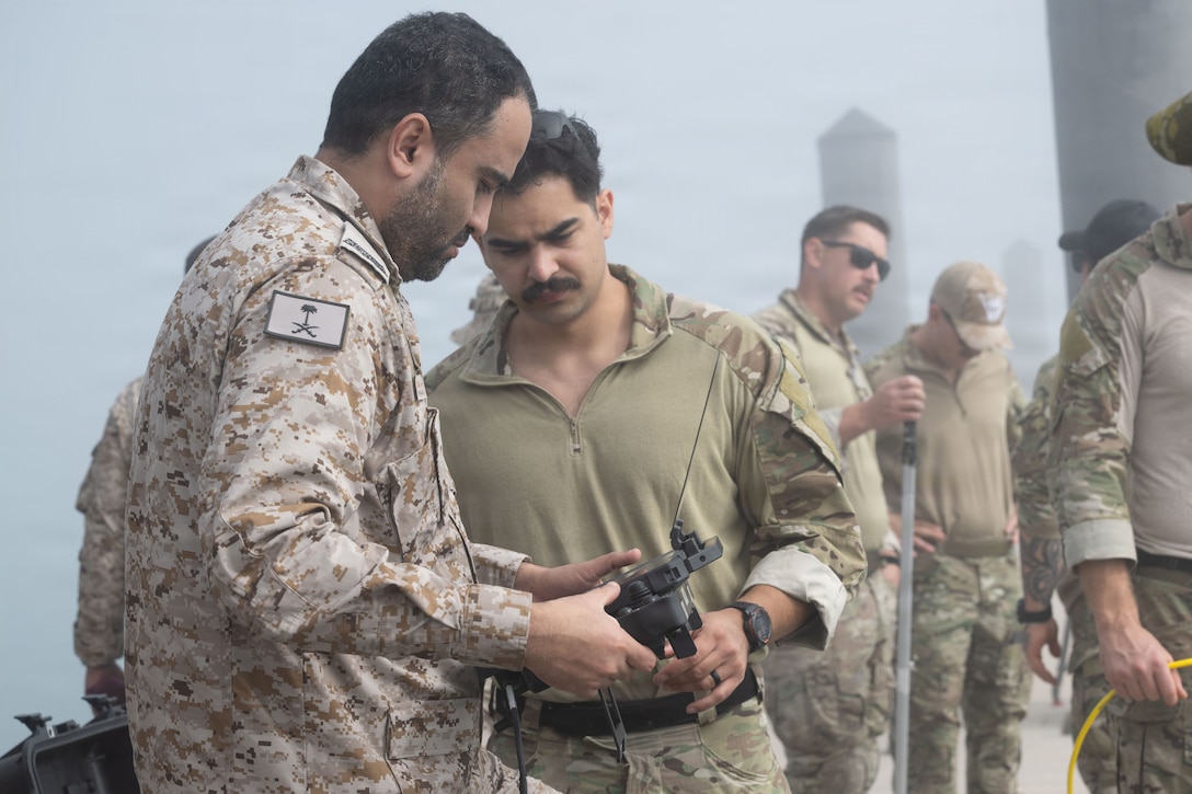 U.S. service members, assigned to Task Force 56, and Royal Saudi Naval Forces operate a remotely operated vehicles during an explosive ordnance disposal subject matter expert exchange aboard Naval Support Activity Bahrain, Feb. 9, 2026. The joint training provided an invaluable opportunity to strengthen interoperability and advance military-to-military cooperation for an array of capabilities. (U.S. Army photo by Private First Class Nicolas Uker)