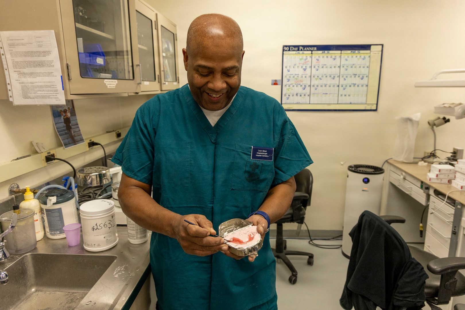 Anaplastologist Louis Gilbert touches up a dental prosthetic at the Maxillofacial Lab at Walter Reed National Military Medical Center, Bethesda, Md., Jan. 23. The Maxillofacial Lab at Walter Reed is dedicated to creating facial prosthetics for the wounded, ill and injured in the Military Health System. (DOW photo by Ann Brandstadter)