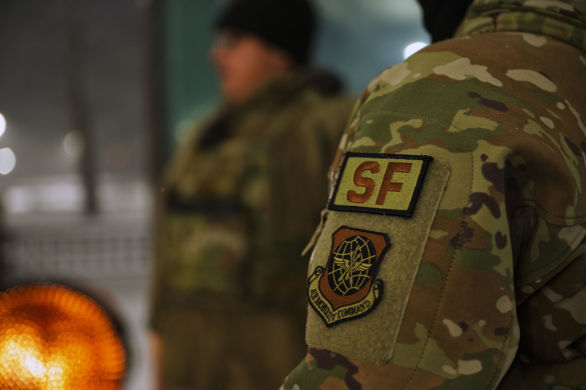 U.S. Air Force Staff Sgt. Luis Morales, 87th Security Forces Squadron patrolman, and Airman 1st Class Elroy Frorup, 87th SFS entry controller, stand guard at an entry control point on Joint Base McGuire-Dix-Lakehurst, N.J., Feb. 22, 2026. As Winter Storm Hernando moved throughout the region, personnel across the installation continued to maintain mission readiness and essential base operations. (U.S. Air Force photo by 2nd Lt. Gabriel Davenport)