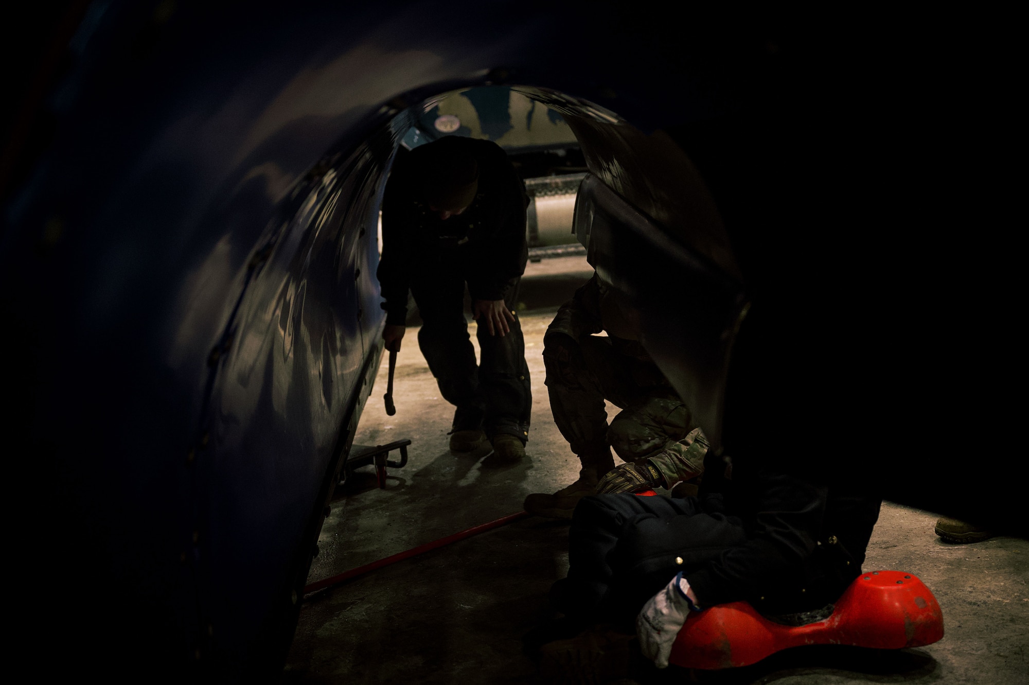 U.S. Air Force members from the 87th Civil Engineer Squadron work on a snow plow before snow clearing operations begin on Joint Base McGuire-Dix-Lakehurst, N.J., Feb. 22, 2026. Even in times of inclement weather, mission essential personnel maintain operational readiness of the base. (U.S. Air Force photo by 2nd Lt. Gabriel Davenport)