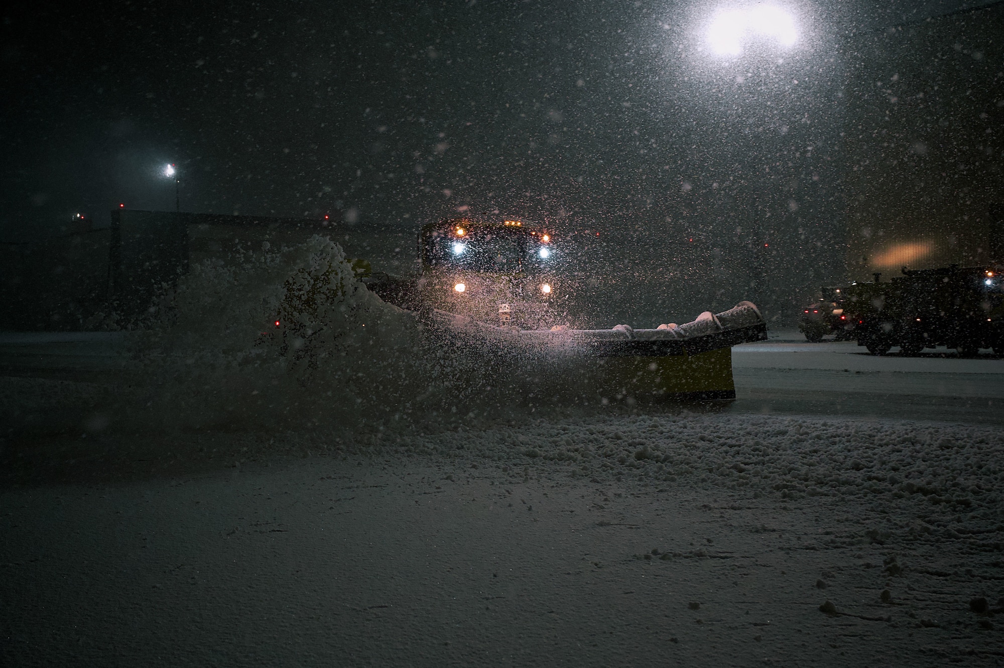 U.S. Air Force Staff Sgt. Yadrian Perez Rodriguez, 87th Civil Engineer Squadron heavy equipment supervisor, clears taxiways at Joint Base McGuire-Dix-Lakehurst, N.J., Feb 22, 2026. Even as Winter Storm Hernando impacted the area, teams maintained operational readiness across flight lines, roadways and support facilities. (U.S. Air Force photo by 2nd Lt. Gabriel Davenport)