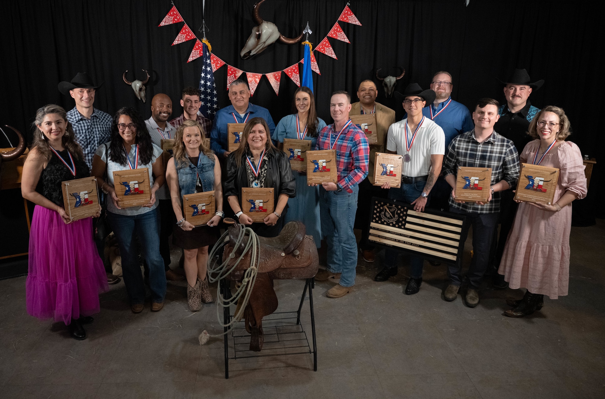 The 2025 47th Flying Training Wing Annual Awards winners come together for a group photo at XL Landings, Feb. 20, 2026. The 47 FTW recognized its top performers of 2025 throughout various categories including enlisted Airmen, officers, civilians and teams. (U.S. Air Force photo by Airman 1st Class Darryl Keith)
