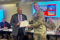 Brig. Gen. Michael Shanley, right, Commanding General, 85th U.S. Army Reserve Support Command, presents Bill Hamilton, the USARC G3/5/7, with a certificate of appreciation during the 85th USARSC Battalion Command Teams Training event held at Arlington Heights, Illinois, February 20-22, 2026.