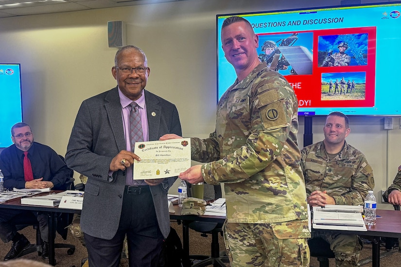 Brig. Gen. Michael Shanley, right, Commanding General, 85th U.S. Army Reserve Support Command, presents Bill Hamilton, the USARC G3/5/7, with a certificate of appreciation during the 85th USARSC Battalion Command Teams Training event held at Arlington Heights, Illinois, February 20-22, 2026.
