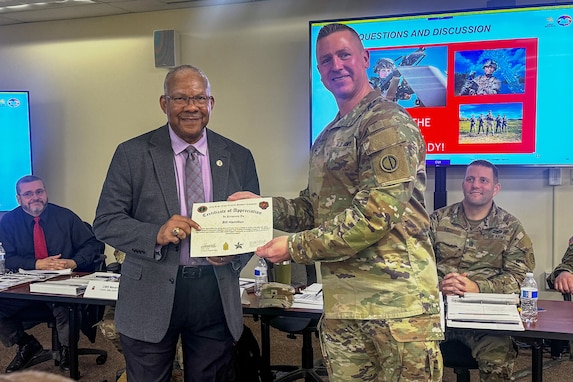 Brig. Gen. Michael Shanley, right, Commanding General, 85th U.S. Army Reserve Support Command, presents Bill Hamilton, the USARC G3/5/7, with a certificate of appreciation during the 85th USARSC Battalion Command Teams Training event held at Arlington Heights, Illinois, February 20-22, 2026.
