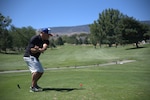 Retired Chief Master Sgt. Shawn Plunket tees off during the  inaugural Col. Mike Fugett Memorial Golf Tournament held at the LakeRidge Golf Course in Reno, Aug. 5, 2024. The tournament helped raise more than $3,000 for the Northern Nevada Children’s Cancer Foundation.