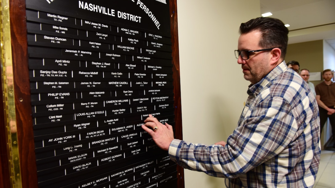 Robert “Clay” Harris, senior engineering technician in the Structural Section, affixes his nameplate onto the “Registered Professional Personnel” board Feb. 20, 2026, at the district headquarters in Nashville, Tennessee. He achieved the Certificate of Management in Building Information Modeling (CM-BIM). (USACE Photo by Lee Roberts)