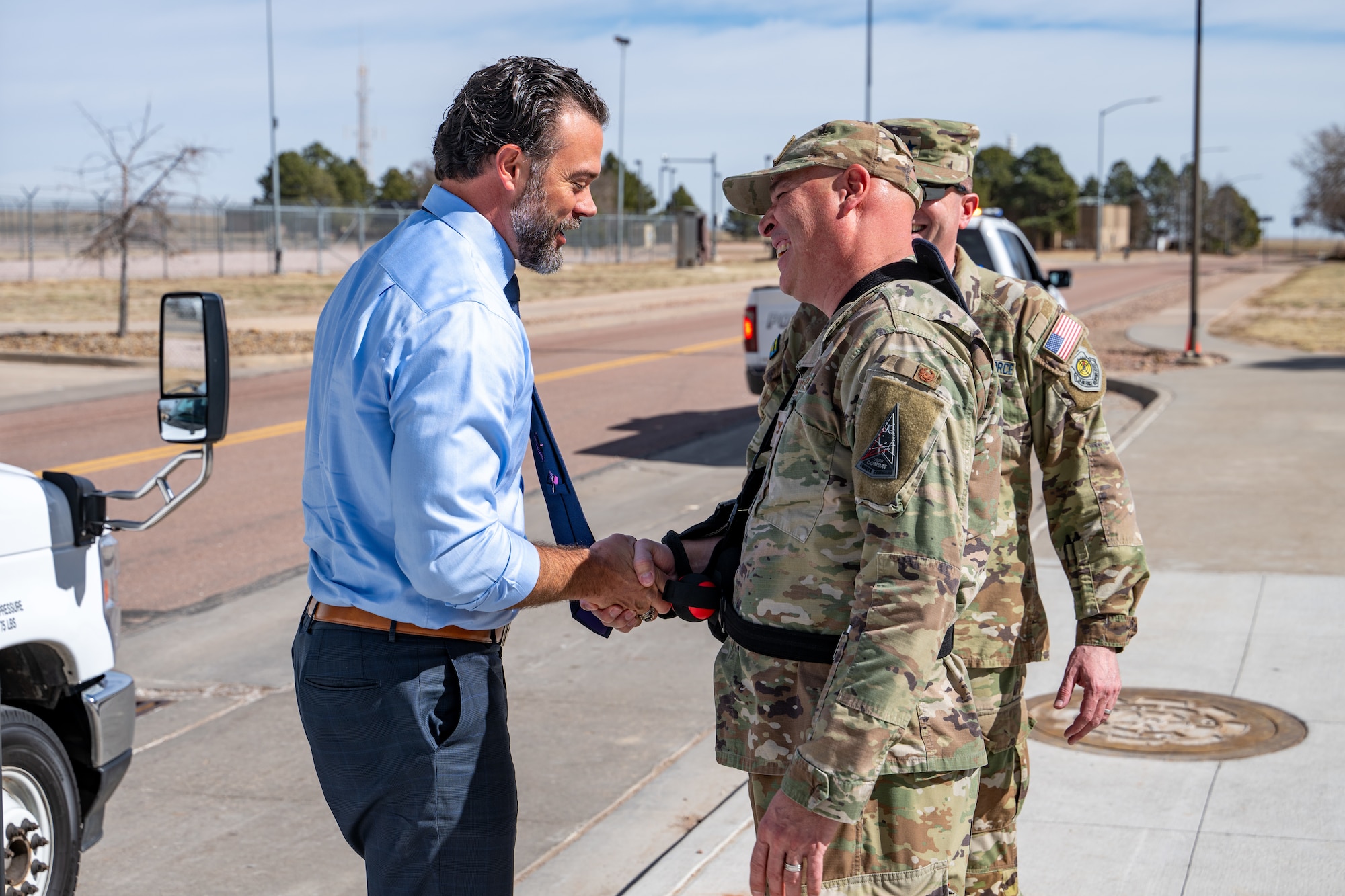 The Honorable Matt Lohmeier, Under Secretary of the Air Force, left, shakes hands with U.S. Air Force Col. David Berrios, Space Base Delta 41 deputy commander, right, during a tour at Schriever Space Force Base, Colorado, Feb. 24, 2026.
