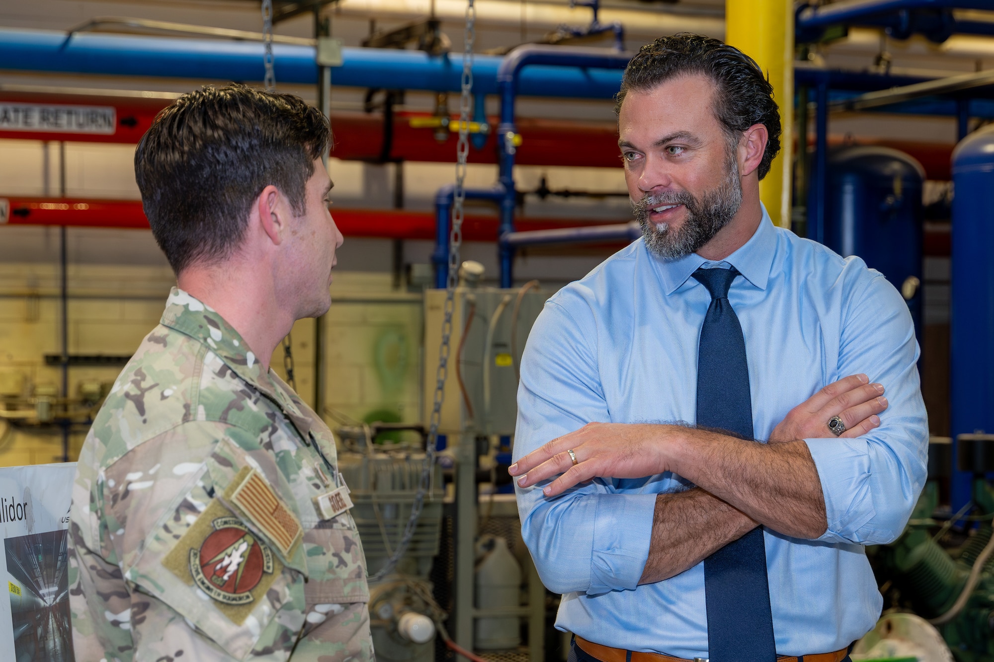 U.S. Air Force Lt. Col. Brandon Goebel, 50th Civil Engineer Squadron commander, left, speaks with The Honorable Matthew Lohmeier, Under Secretary of the Air Force, during a tour at Schriever Space Force Base, Colorado, Feb. 24, 2026.