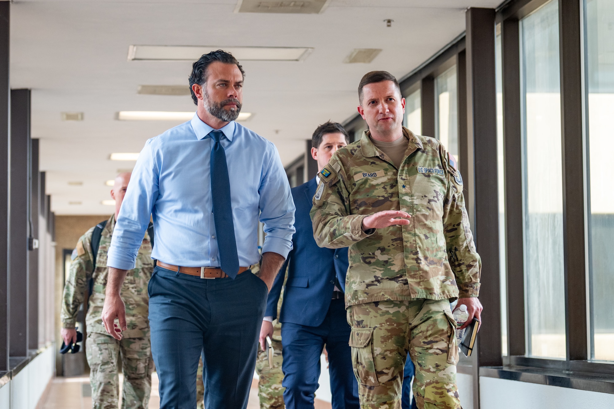 The Honorable Matt Lohmeier, Under Secretary of the Air Force, left, walks with U.S. Space Force Brig. Gen. Casey M. Beard, USSF Combat Forces Command deputy commander, right, during a tour at Schriever Space Force Base, Colorado, Feb. 24, 2026.