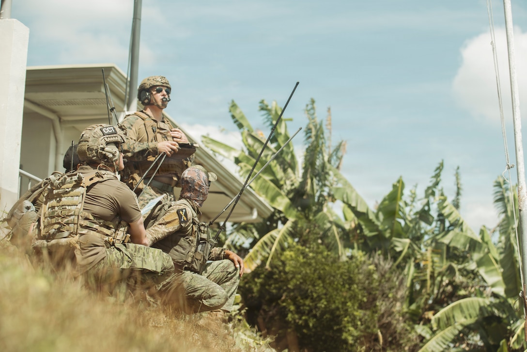 U.S. Marine Corps Maj. David Harris, top left, the air officer of Marine Rotational Force-Southeast Asia, I Marine Expeditionary Force, along with U.S. Air Force Airmen assigned to the Air Force Special Operations Command, and Philippine Air Force airmen assigned to the Air Force Special Operations Command observe a U.S. Air Force B-52 Stratofortress bomber hit its target during a bomber live drop exercise at Crow Valley Gunnery Range, Philippines, Feb. 2, 2026. MRF-SEA is a flexible task force that varies in size, capability, and composition, to accomplish different types of missions as a purpose-built unit, maintaining a forward presence and enhancing Marine Corps crisis and contingency response capabilities. MRF-SEA is uniquely organized to support security cooperation and advance mutual security objectives shared with Southeast Asian Allies and partners. (U.S. Marine Corps photo by Sgt. Luis Agostini)
