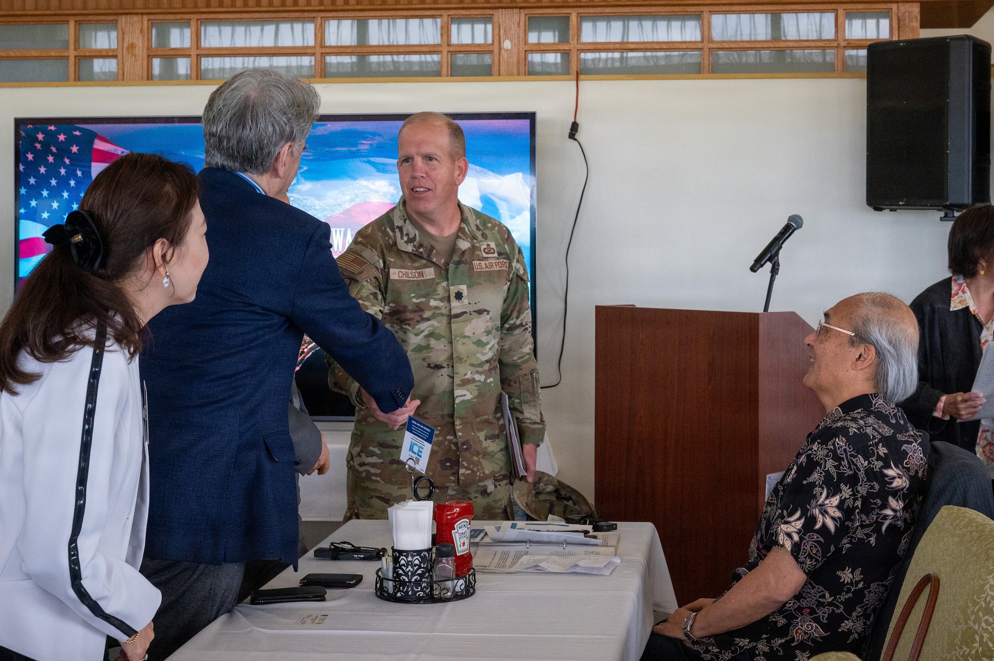 two people shake hands