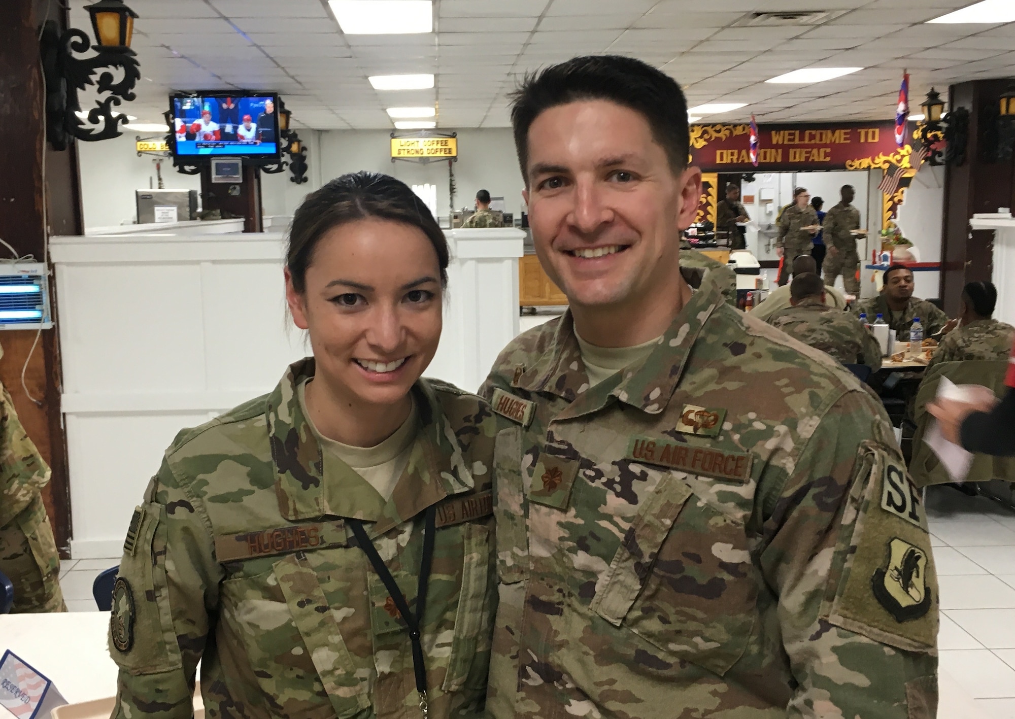man and woman standing together in air force uniform