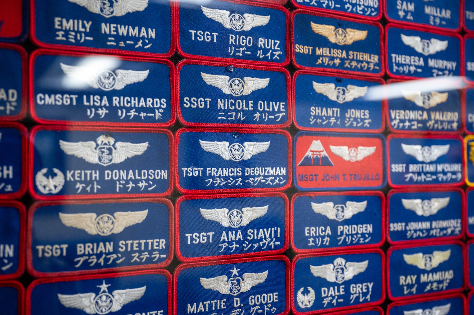 Name tapes of past Aeromedical Evacuation Airmen displayed inside the 18th Aeromedical Evacuation Squadron building at Kadena Air Base, Feb. 19, 2026. The display reflects the squadron’s enduring legacy of service and the generations of Airmen who have supported AE operations in the Indo-Pacific. (U.S. Air Force photo by Airman 1st Class Francisco Huerta)