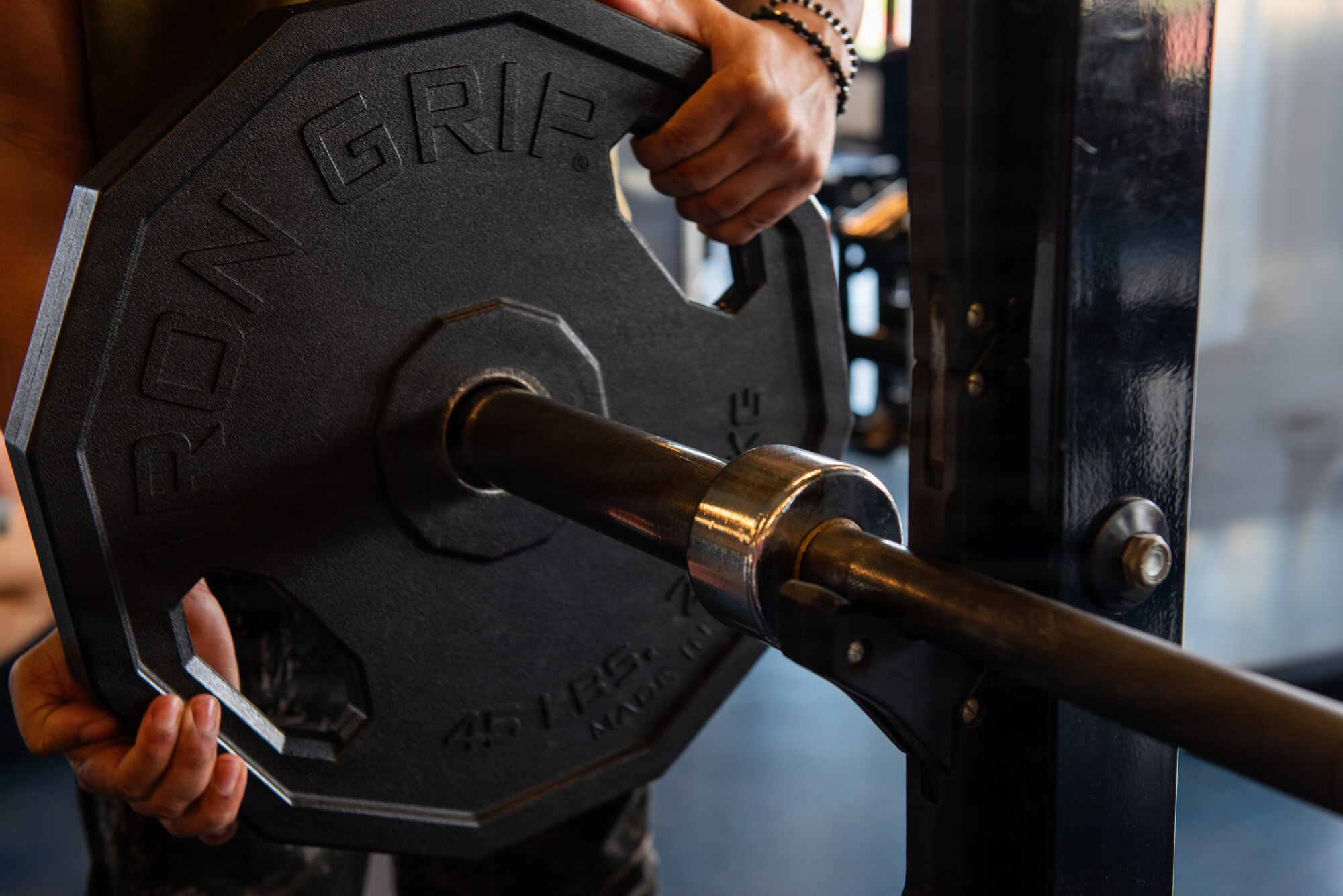 Patron adds weight to barbell