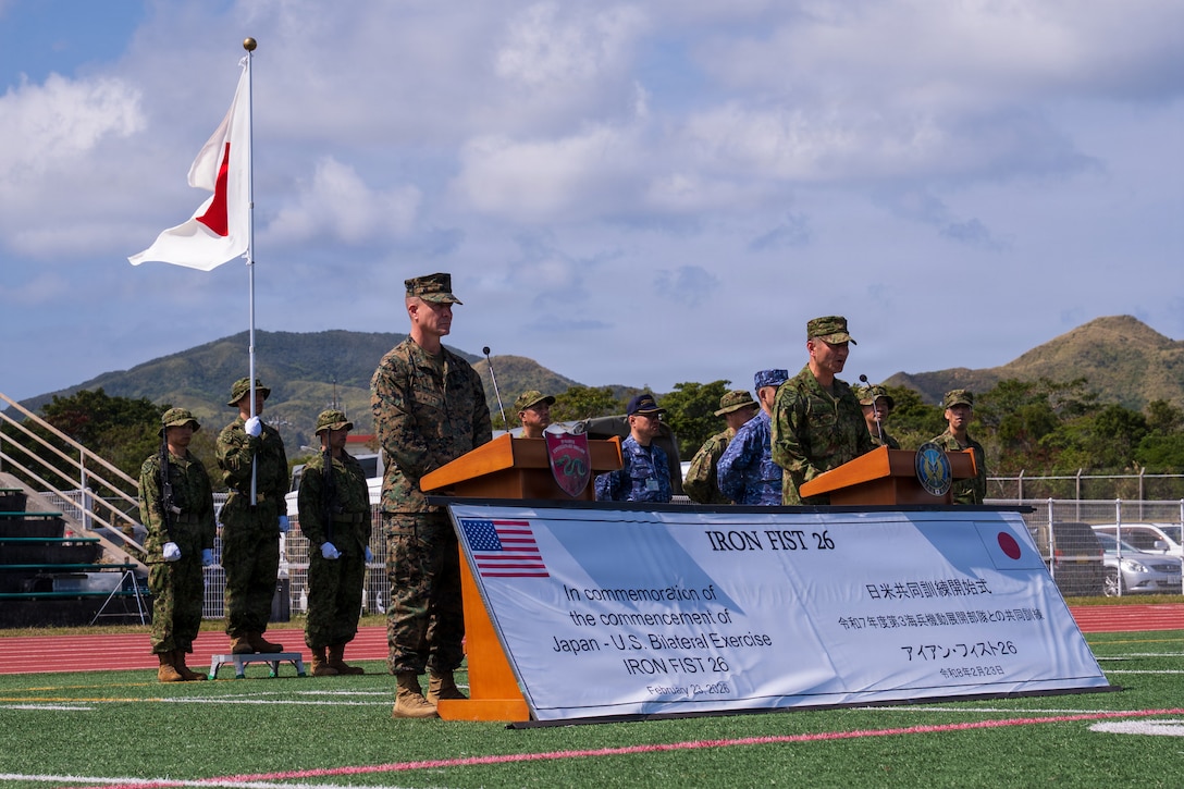 CAMP HANSEN, Okinawa (February 23, 2026) U.S. Marine Corps Brig. Gen. Ryan Hoyle, left, commanding general, 3rd Marine Expeditionary Brigade, and Japan Ground Self-Defense Force (JGSDF) Maj. Gen. Toshikatsu Musha, commanding general, JGSDF Amphibious Rapid Deployment Brigade, right, give remarks during the opening ceremony of Exercise Iron Fist 2026 at Camp Hansen, Okinawa, Japan, Feb. 23, 2026. Iron Fist is an annual bilateral exercise designed to increase interoperability and strengthen the relationships between the U.S. Marine Corps, the U.S. Navy, the JGSDF, and the Japan Maritime Self-Defense Force. (U.S. Navy photo by Mass Communication Specialist 2nd Class Danilo Reynoso)