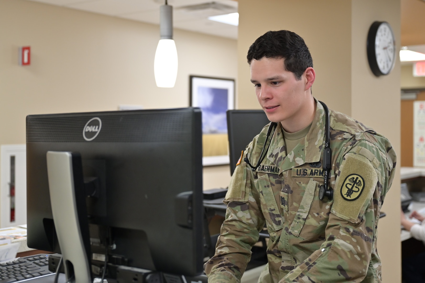 Army Capt. Jacob Baehman, a resident physician with the Family Medicine Residency Clinic, reviews patient information prior to seeing a patient at Carl R. Darnall Army Medical Center. Residency training prepares military physicians to care for patients while supporting military readiness.