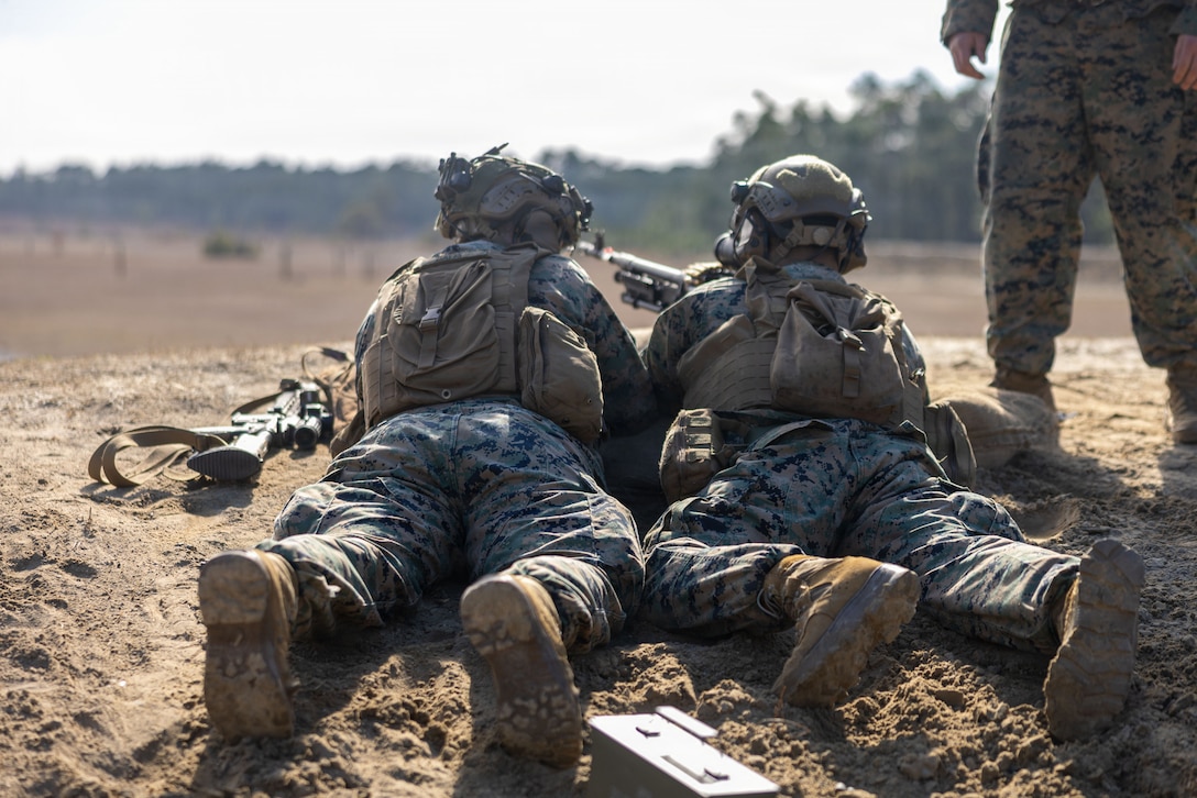 U.S. Marines with 1st Battalion, 2nd Marine Regiment, 2nd Marine Division, fire an M240B medium machine gun during a simulated squad attack on Marine Corps Base Camp Lejeune, North Carolina, Jan. 22, 2026. The live fire drone attack simulation was held to demonstrate the integration of the NEROS Archer, a newly introduced first-person-view drone employed by the Department of War, with infantry Marines. (U.S. Marine Corps photo by Lance Cpl. Isabelle Hutmacher)