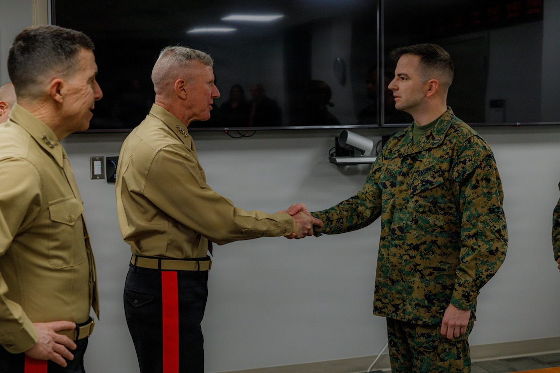 The 39th Commandant of the Marine Corps, Gen. Eric M. Smith, greets Capt. Austin Wiemann, the programs and assessments section head for Training and Education command, at Marine Corps Base Quantico, Virginia, Feb. 18, 2026. Gen. Smith visited Training and Education Command to recognize and award Marines for their performance. (U.S. Marine Corps photo by Cpl. Memphis Pitts)