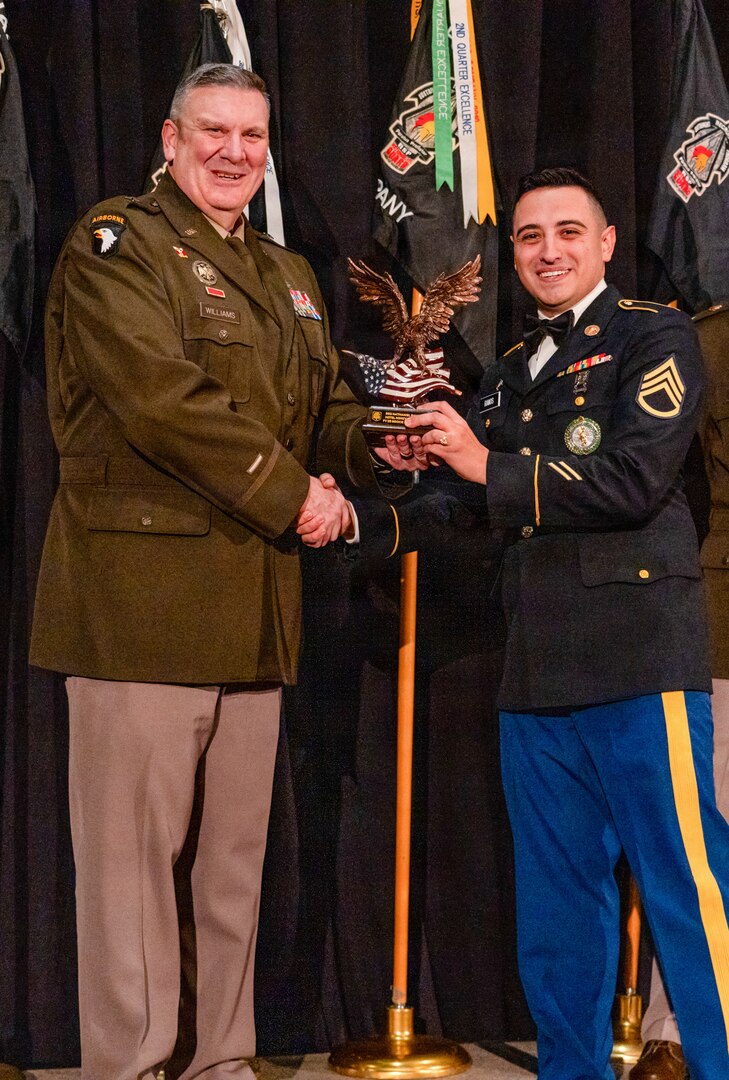 Brig. Gen. Lenny Williams, the Assistant Adjutant General – Army of the Illinois National Guard and Commander of the Illinois Army National Guard, presents Staff Sgt. Nathaniel Ramos with the Illinois Army National Guard Recruiting and Retention Battalion “Rookie of the Year” Award at the battalion’s annual Military Ball and Awards Ceremony, Jan. 31, in Springfield.