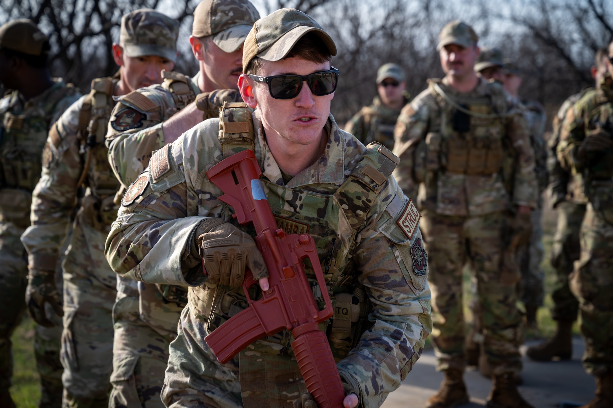 U.S. Air Force Senior Airman Brandon Sanislo, 21st Combat Air Base Squadron structural apprentice, prepares to enter a close quarters battle training scenario during exercise Bamboo Eagle 26-1 at Dyess Air Force Base, Texas, Feb. 20, 2026. The field training exercise reinforced the 21st CABS’s decision-making skills and adaptability, mirroring real-world mission demands. (U.S. Air Force photo by Airman 1st Class Adrien Tran)