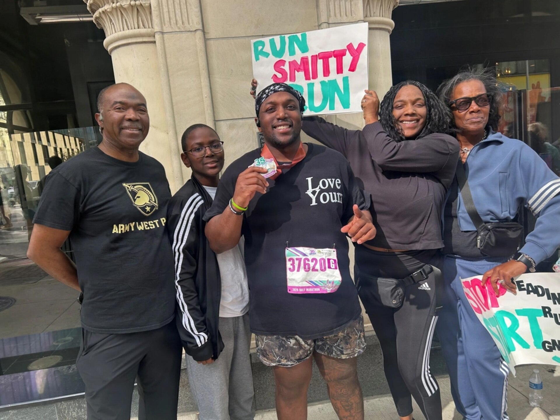U.S. Army Capt. Tony Smith (center) poses with his family after the Austin Half Marathon, Feb. 15, 2026.