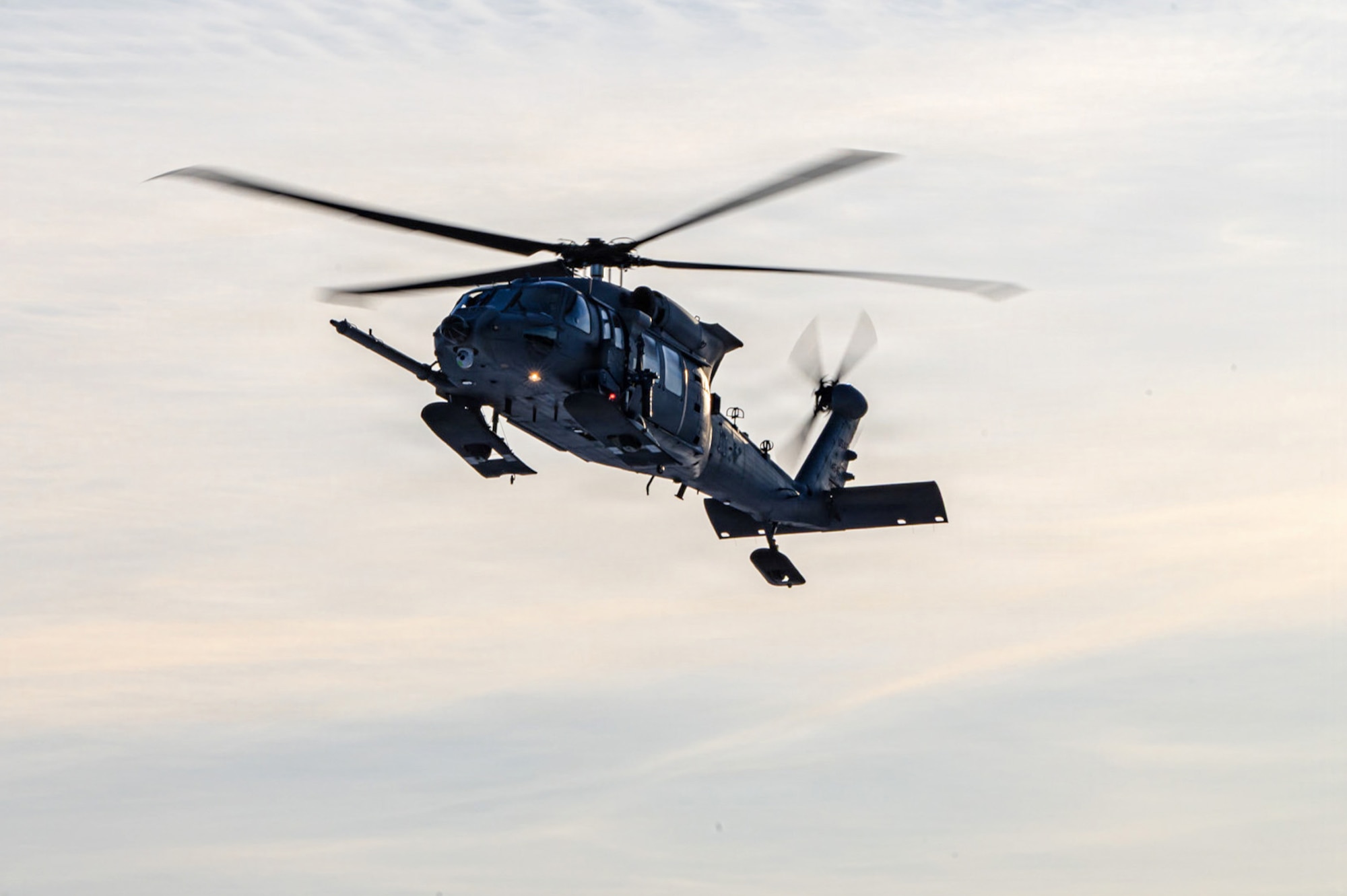 An Alaska Air National Guard HH-60W Jolly Green II helicopter, assigned to the 210th Rescue Squadron, 176th Wing, returns to Joint Base Elmendorf-Richardson, Alaska, after conducting a rescue mission for an injured snowmachiner, Feb. 21, 2026.