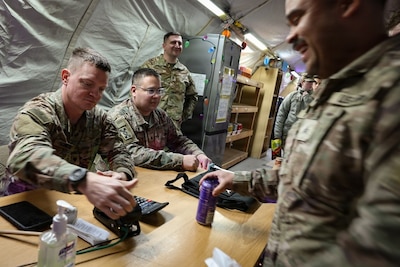 Illinois Army National Guard Spc. Kevin Schreier with the Springfield, Ill.-based 232nd Combat Sustainment Support Battalion, conducts a transaction at the Army & Air Force Exchange Authorized Imprest Fund Activity (AIFA) PX in Karliki, Poland.