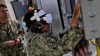 Augmented reality was used to place new and experienced Sailors in various scenarios that mimic battle conditions to identify issues for improving the elevator system and developing better training. (U.S. Navy Photo by Jay Butterbaugh, CTR)