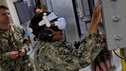 Augmented reality was used to place new and experienced Sailors in various scenarios that mimic battle conditions to identify issues for improving the elevator system and developing better training. (U.S. Navy Photo by Jay Butterbaugh, CTR)