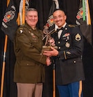Maj. Gen. Lenny Williams, the Assistant Adjutant General – Army of the Illinois National Guard and Commander of the Illinois Army National Guard, presents Staff Sgt. Francisco Orozco with the Army National Guard Director’s 54 Award during the Illinois Army National Guard Recruiting and Retention Battalion’s Military Ball and Awards Ceremony on Jan. 31 in Springfield.