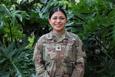 Spc. Antonia Arras, an inpatient and oncology pharmacy technician at Tripler Army Medical Center, receives the Larry C. Nesmith Enlisted Technician Award on Feb. 4 for her exceptional technical expertise, leadership, and dedication to patient safety.