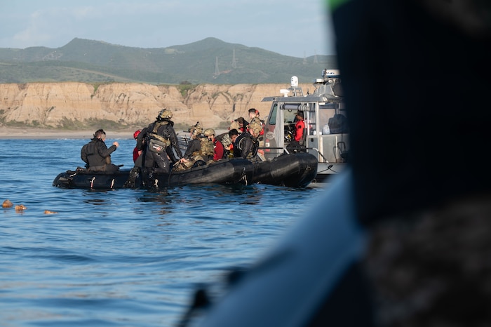 U.S. Air Force pararescuemen regroup after jumping out of an aircraft during Exercise Bamboo Eagle 26-1 off the coast of San Diego, California, Feb. 13, 2026. Through rigorous scenarios, the exercise ensures Airmen and Guardians are ready to deliver decisive airpower and sustain operations in the most demanding environments. (U.S. Air Force photo by Airman 1st Class Jaden Kidd)