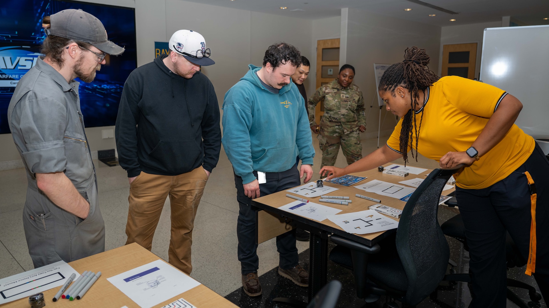 Ashley Floyd, Acting Director of Strategic Educational Outreach at Naval Surface Warfare Center, Carderock Division, leads attendees of Engineers Week events in a robotics coding challenge
