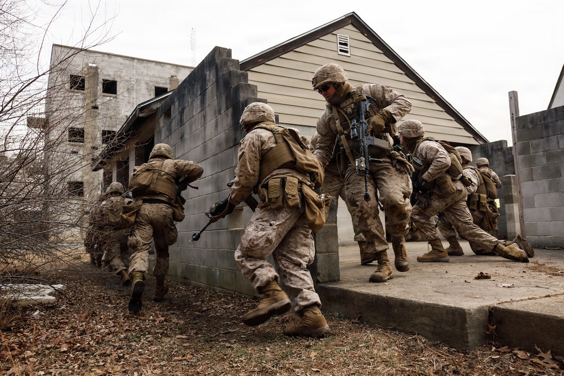 U.S. Marine Corps students with Company F, The Basic School, participate in a platoon attack at Marine Corps Base Quantico, Virginia, Feb. 25, 2026. The purpose of the simulated platoon attacks was to introduce Marines to the fundamentals of Military Operations on Urban Terrain training, evaluate their leadership in high-stress environments, and develop them into confident, provisional rifle platoon commanders. (U.S. Marine Corps photo by Cpl. Joshua Barker)