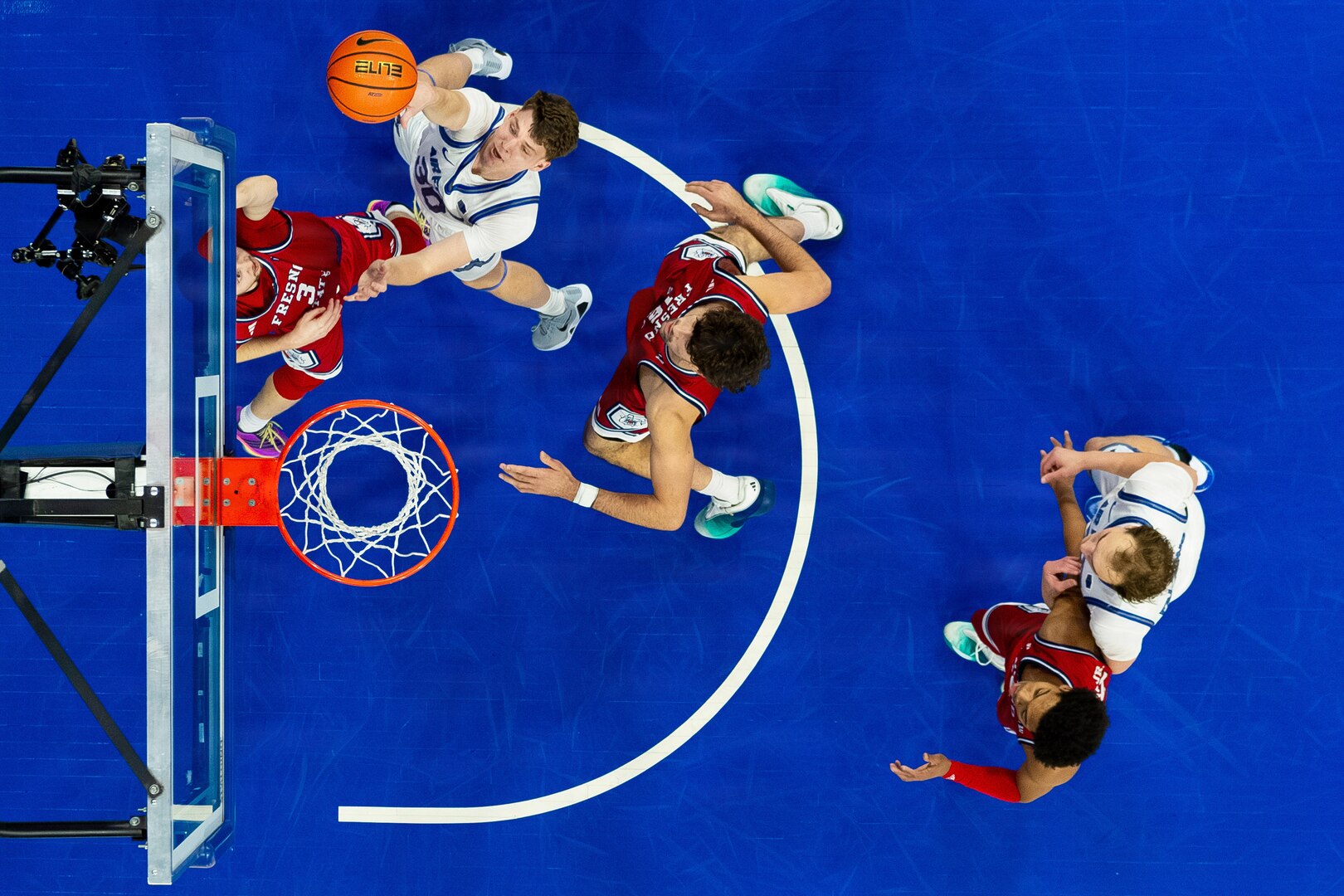 Basketball players on court