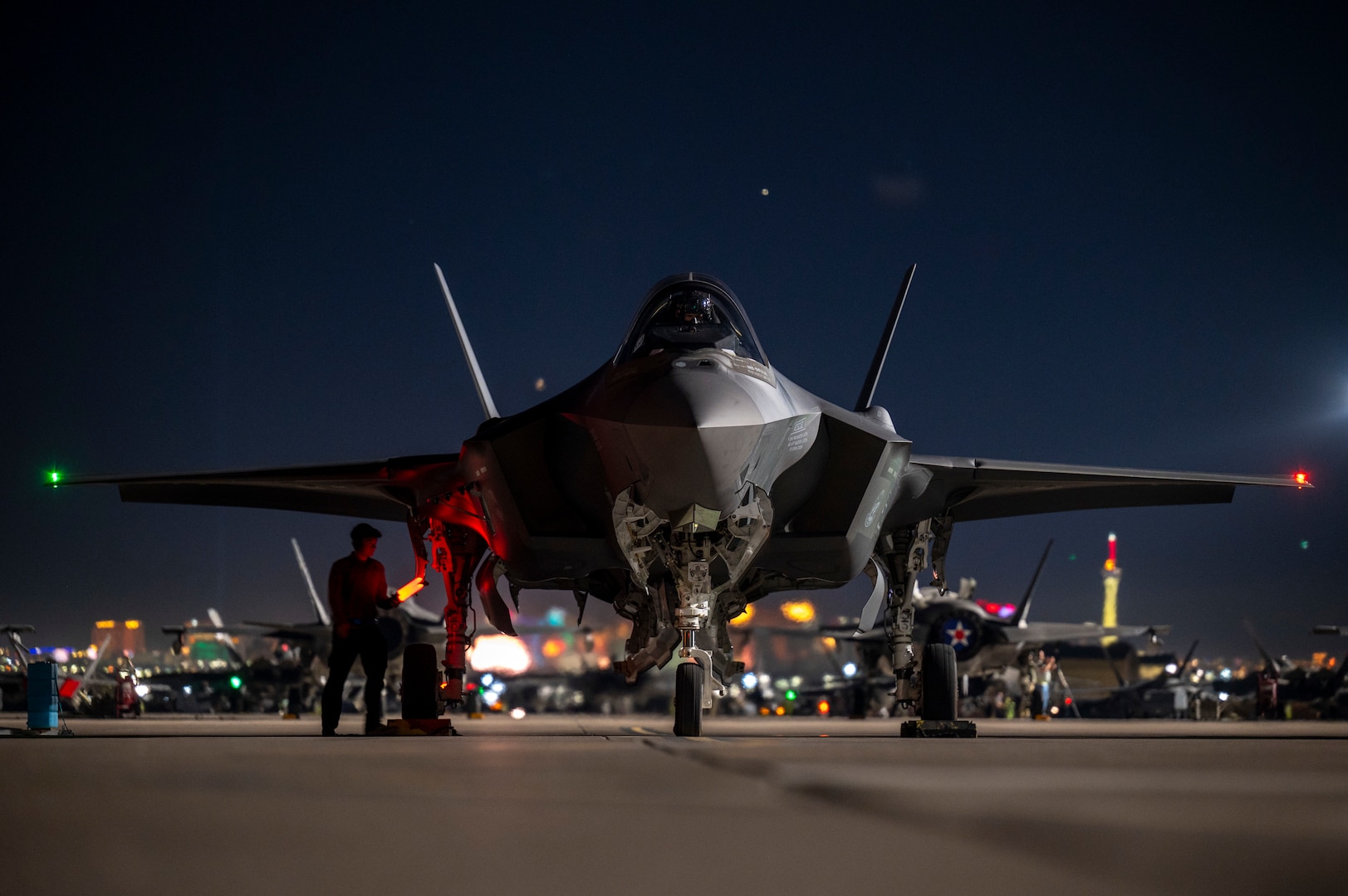 F-35A parked on flightline at night