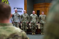 Senior leaders stand alongside Lt. Col. Lionel Gonzalez during his retirement ceremony at Illinois National Guard headquarters in Springfield, Illinois, Feb. 22.