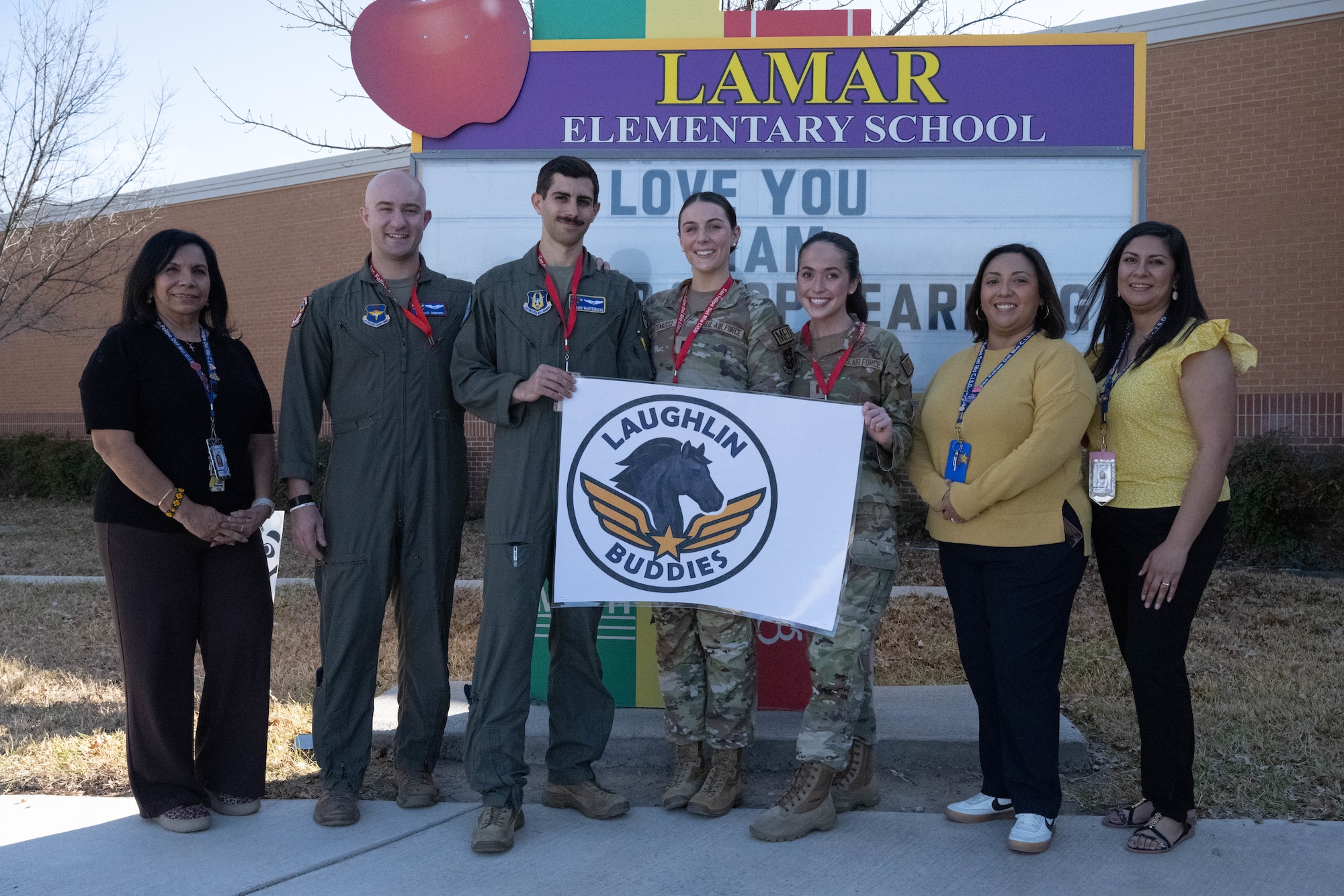 U.S. Air Force Airmen assigned to the 47th Flying Training Wing and faculty from Lamar Elementary School pose for a group photo at Del Rio, Texas, Feb. 19, 2026. The 47 FTW and Lamar Elementary created the Laughlin Buddies afterschool program to teach students about STEM careers inside the Air Force and beyond. (U.S. Air Force photo by Airman 1st Class Darryl Keith)