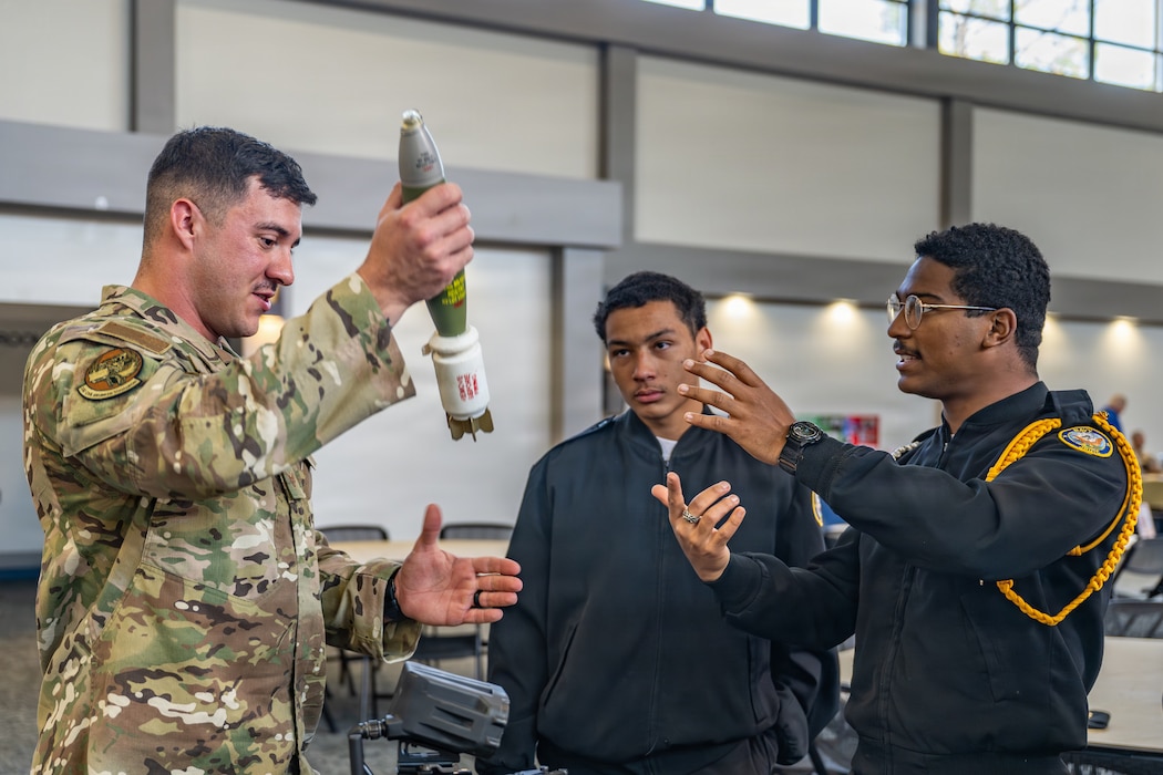 A U.S. Airman assigned to the 23d Wing explains the different types of explosives that an Explosive Ordnance Disposal (EOD) technician may encounter to local junior ROTC students during Saluting Our Aviation Roots (SOAR) Week at Moody Air Force Base, Georgia, Feb. 24, 2026. The second day of SOAR gave students the opportunity to learn about various units across the installation. (U.S. Air Force photo by Senior Airman Savannah Carpenter)