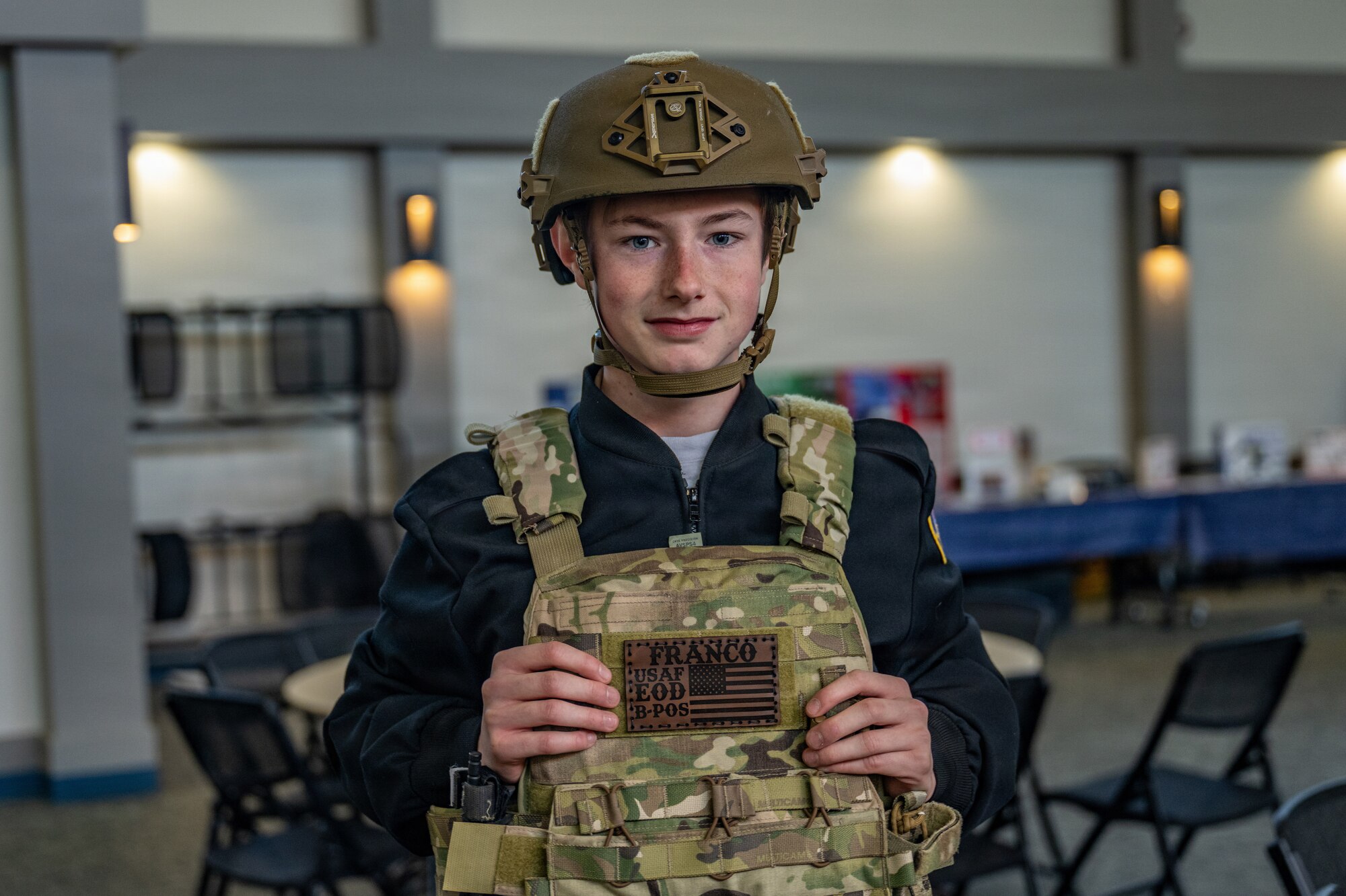 A local junior ROTC student tries on a vest and helmet during Saluting Our Aviation Roots (SOAR) Week at Moody Air Force Base, Georgia, Feb. 24, 2026. During the event, students engaged with Airmen and explored various mission capabilities and career opportunities on base. (U.S. Air Force photo by Senior Airman Savannah Carpenter)